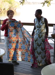Barb getting help from Helen with her chitenga