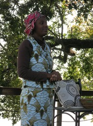 demonstrating wearing a chitenga as a head dress