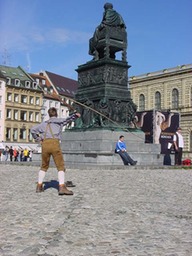 cracking a whip on the plaza 