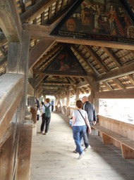inside Chapel Bridge; note art work