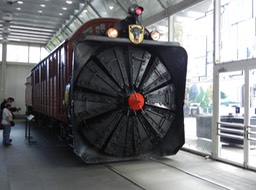 locomotive with snow blower on the front; could hurl snow 90 meters sideways and 16 meters high
