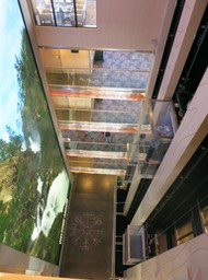 elevators on right; 17.5 meter tall LED screen on left