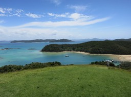 hiking on Urupukapuka Island (that's our boat below)