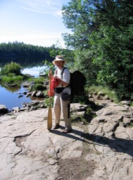 Barb carrying gear on portage