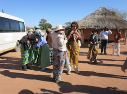 ladies getting their chitengas on for a village visit