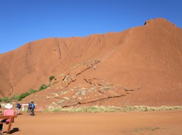 people climbing Uluru