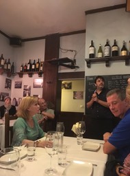 restaurant owner explaining our final group dinner